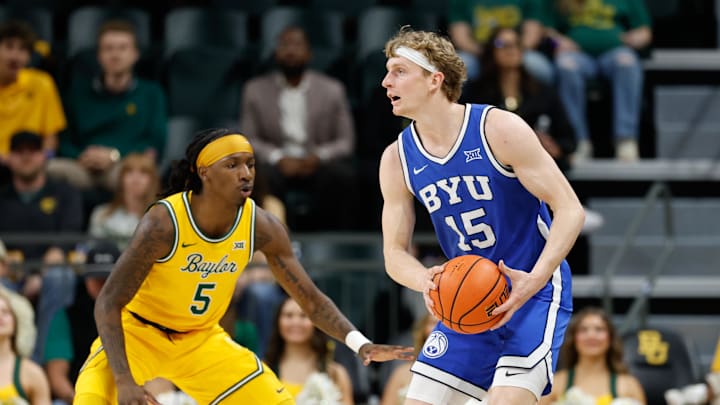 Feb 10, 2026; Waco, Texas, USA; BYU Cougars guard Richie Saunders (15) looks to pass against Baylor Bears guard Obi Agbim (5) during the first half at Paul and Alejandra Foster Pavilion. Mandatory Credit: Chris Jones-Imagn Images