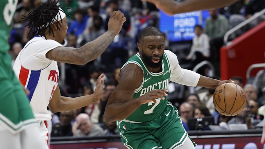 Boston Celtics guard Jaylen Brown drives against Detroit Pistons forward Ronald Holland II.