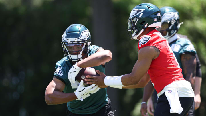 May 30, 2024; Philadelphia, PA, USA; Philadelphia Eagles quarterback Jalen Hurts (1) hands off to running back Saquon Barkley (26) during practice at NovaCare Complex. Mandatory Credit: Bill Streicher-USA TODAY Sports