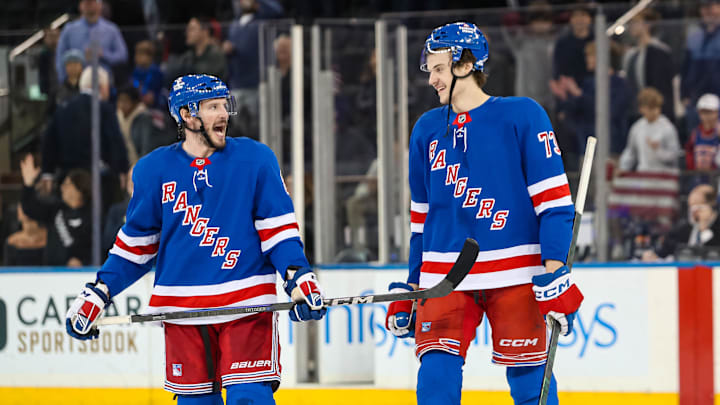 Mar 22, 2025; New York, New York, USA; New York Rangers center Matt Rempe (73) and center J.T. Miller (8) celebrate after a 5-3 win against the Vancouver Canucks at Madison Square Garden. Mandatory Credit: Danny Wild-Imagn Images