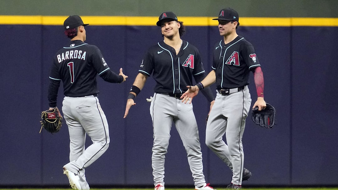 Arizona Diamondbacks left fielder Jorge Barrosa (1), center fielder Alek Thomas (5) and right fielder Corbin Carroll (7) celebrate a win over the Milwauk at American Family Field on April 29. Arizona Diamondbacks left fielder Jorge Barrosa (1), center fielder Alek Thomas (5) and right fielder Corbin Carroll (7) celebrate a win over the Milwauk at American Family Field on April 29.