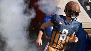 Oct 19, 2024; Champaign, Illinois, USA;  Illinois Fighting Illini quarterback Luke Altmyer (9) takes the field before the first half against the Michigan Wolverines at Memorial Stadium. Mandatory Credit: Ron Johnson-Imagn Images