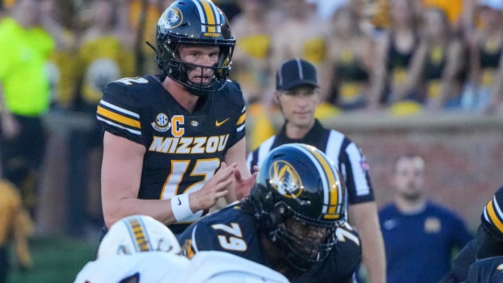 Aug 29, 2024; Columbia, Missouri, USA; Missouri Tigers quarterback Brady Cook (12) readies for the snap against the Murray State Racers during the first half at Faurot Field at Memorial Stadium. Mandatory Credit: Denny Medley-USA TODAY Sports