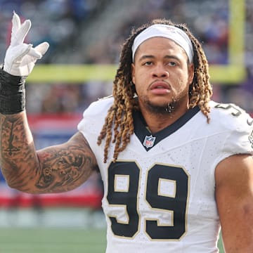 Dec 8, 2024; East Rutherford, New Jersey, USA; New Orleans Saints defensive end Chase Young (99) looks up at fans before the game against the New York Giants at MetLife Stadium. Mandatory Credit: Vincent Carchietta-Imagn Images