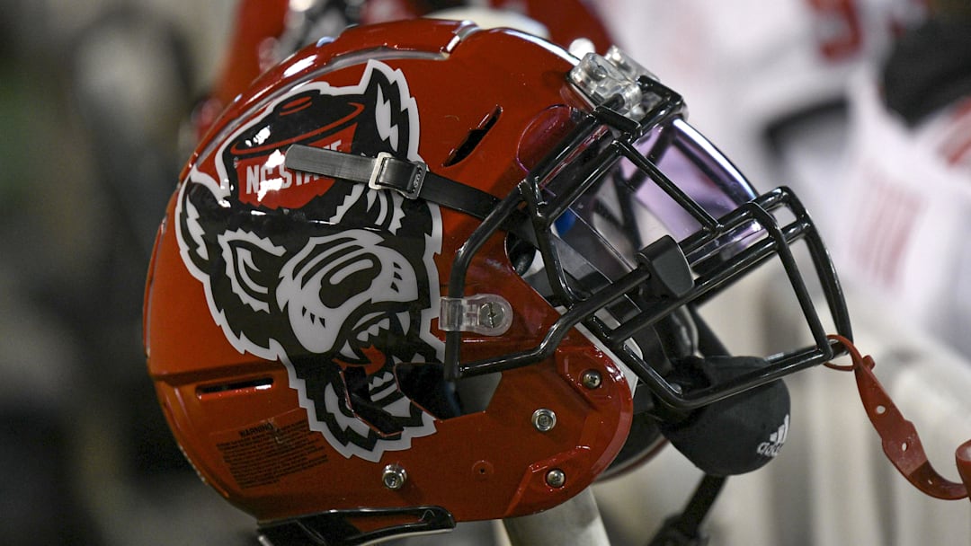 Nov 13, 2021; Winston-Salem, North Carolina, USA; A North Carolina State Wolfpack helmet seen on the sideline during the second half against the Wake Forest Demon Deacons at Truist Field. Mandatory Credit: William Howard-Imagn Images