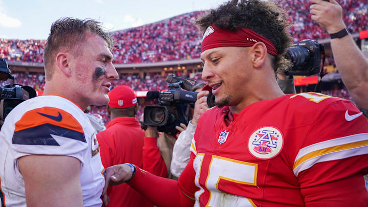 Nov 10, 2024; Kansas City, Missouri, USA; Denver Broncos quarterback Bo Nix (10) talks with Kansas City Chiefs quarterback Patrick Mahomes (15) after the game at GEHA Field at Arrowhead Stadium. Mandatory Credit: Denny Medley-Imagn Images