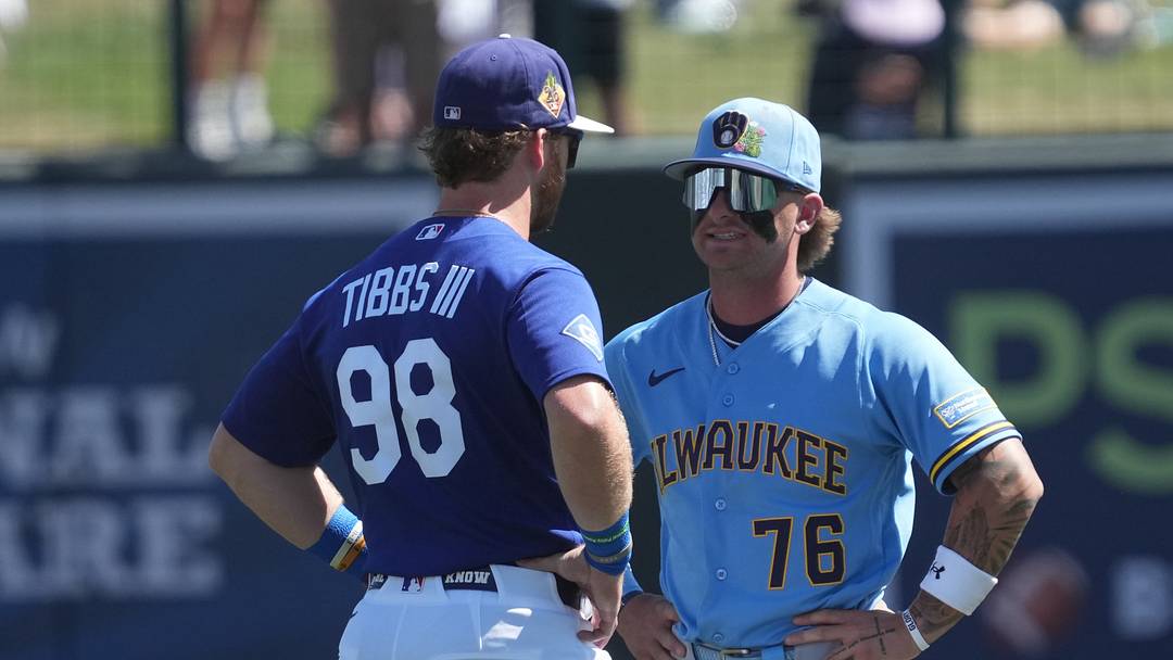 Los Angeles Dodgers right fielder James Tibbs III (98) and Milwaukee Brewers shortstop Jett Williams (76) talk before a game at Camelback Ranch-Glendale on March 16, 2026.