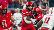 Aug 28, 2025; Kansas City, Missouri, USA; Cincinnati Bearcats quarterback Brendan Sorsby (2) hands the ball off to running back Evan Pryor (6) against the Nebraska Cornhuskers during the first quarter at GEHA Field at Arrowhead Stadium. Mandatory Credit: Dylan Widger-Imagn Images