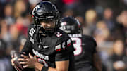 Nov 15, 2025; Cincinnati, Ohio, USA;  Cincinnati Bearcats quarterback Brendan Sorsby (2) runs with the ball as he looks to pass against the Arizona Wildcats in the second half at Nippert Stadium. Mandatory Credit: Aaron Doster-Imagn Images