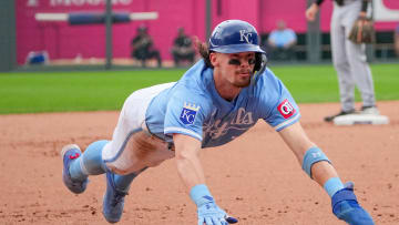 Jul 21, 2024; Kansas City, Missouri, USA; Kansas City Royals shortstop Bobby Witt Jr. (7) slides into third base against the Chicago White Sox in the eight inning at Kauffman Stadium. Mandatory Credit: Denny Medley-USA TODAY Sports