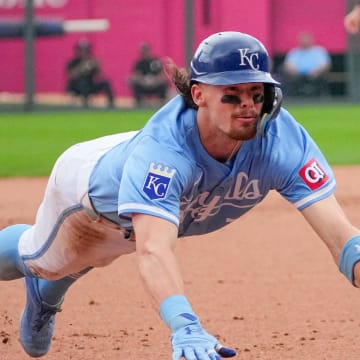 Jul 21, 2024; Kansas City, Missouri, USA; Kansas City Royals shortstop Bobby Witt Jr. (7) slides into third base against the Chicago White Sox in the eight inning at Kauffman Stadium. Mandatory Credit: Denny Medley-USA TODAY Sports