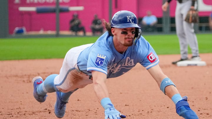 Jul 21, 2024; Kansas City, Missouri, USA; Kansas City Royals shortstop Bobby Witt Jr. (7) slides into third base against the Chicago White Sox in the eight inning at Kauffman Stadium. Mandatory Credit: Denny Medley-USA TODAY Sports