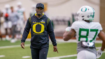 Oregon co-offensive coordinator and wide receivers coach Junior Adams leads a drill during practice at the Moshofsky Center in Eugene on Tuesday, April 12, 2022.