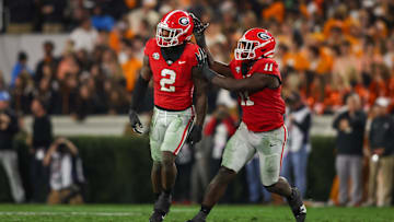 Nov 16, 2024; Athens, Georgia, USA; Georgia Bulldogs linebacker Smael Mondon Jr. (2) celebrates with linebacker Jalon Walker (11) after a tackle against the Tennessee Volunteers in the second quarter at Sanford Stadium. Mandatory Credit: Brett Davis-Imagn Images
