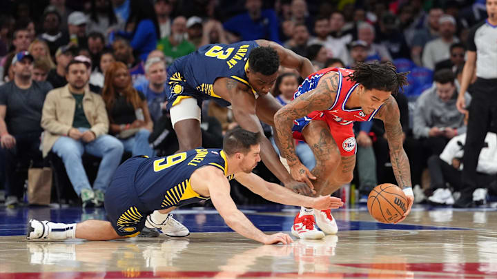 Philadelphia 76ers guard Jalen-Hood Schifino (17) battles for the ball against Indiana Pacers guard T.J. McConnell (9) and center Thomas Bryant (3) in the third quarter at Wells Fargo Center. Hood-Schifino and Bryant are both former Hoosiers. Philadelphia 76ers guard Jalen-Hood Schifino (17) battles for the ball against Indiana Pacers guard T.J. McConnell (9) and center Thomas Bryant (3) in the third quarter at Wells Fargo Center. Hood-Schifino and Bryant are both former Hoosiers.