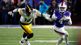 Buffalo Bills running back James Cook (4) slips tackle by Pittsburgh Steelers linebacker Myles Jack