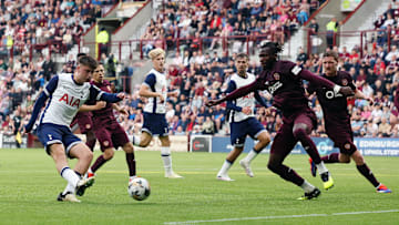 Tottenham have made a big gain with the young midfielder signing his first professional contract despite interest from Real Madrid, PSG, Manchester United, and others.