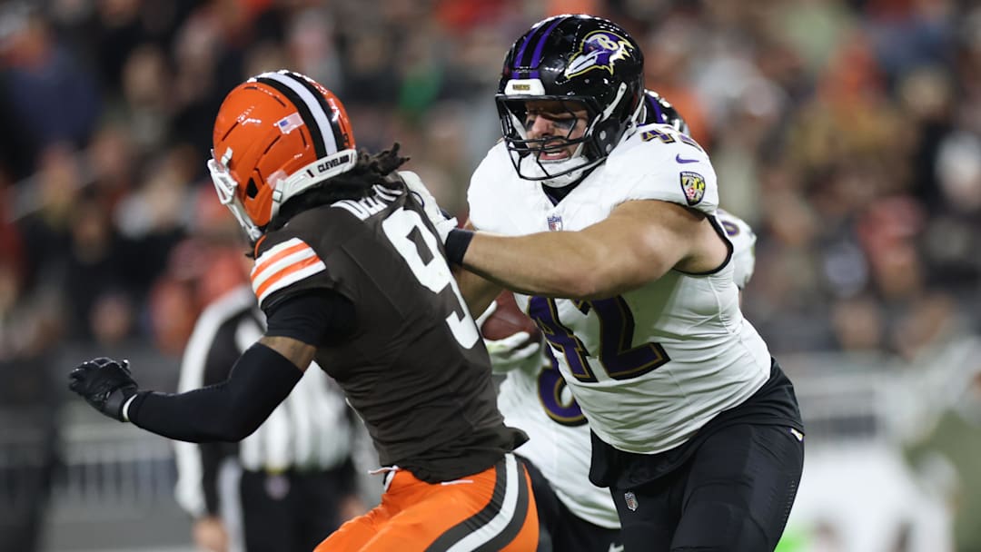 Nov 16, 2025; Cleveland, Ohio, USA; Baltimore Ravens fullback Patrick Ricard (42) blocks Cleveland Browns safety Grant Delpit (9) during the third quarter at Huntington Bank Field. Mandatory Credit: Scott Galvin-Imagn Images
