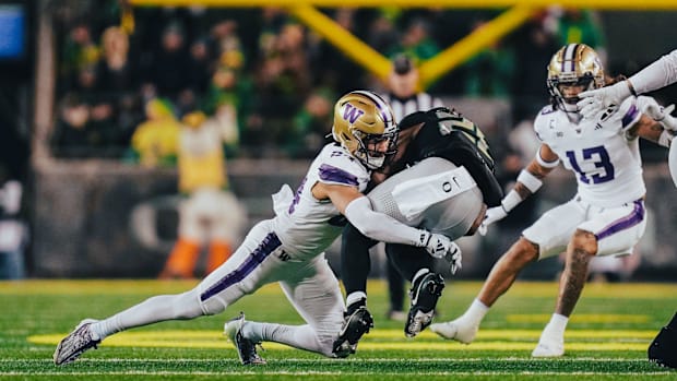 Husky safety Makell Esteen makes a tackle at Oregon.