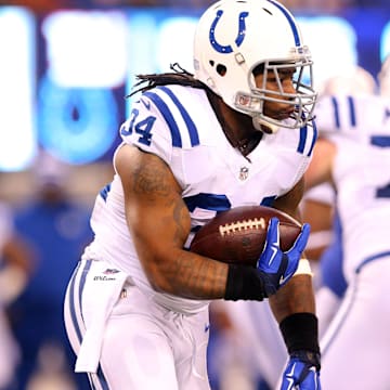Nov 3, 2014; East Rutherford, NJ, USA; Indianapolis Colts running back Trent Richardson (34) runs the ball against the New York Giants during the first quarter at MetLife Stadium. Mandatory Credit: Brad Penner-Imagn Images