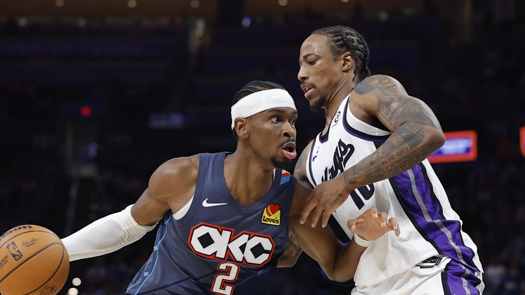 Nov 19, 2025; Oklahoma City, Oklahoma, USA; Oklahoma City Thunder guard Shai Gilgeous-Alexander (2) moves past Sacramento Kings guard DeMar DeRozan (10) during the second half at Paycom Center.