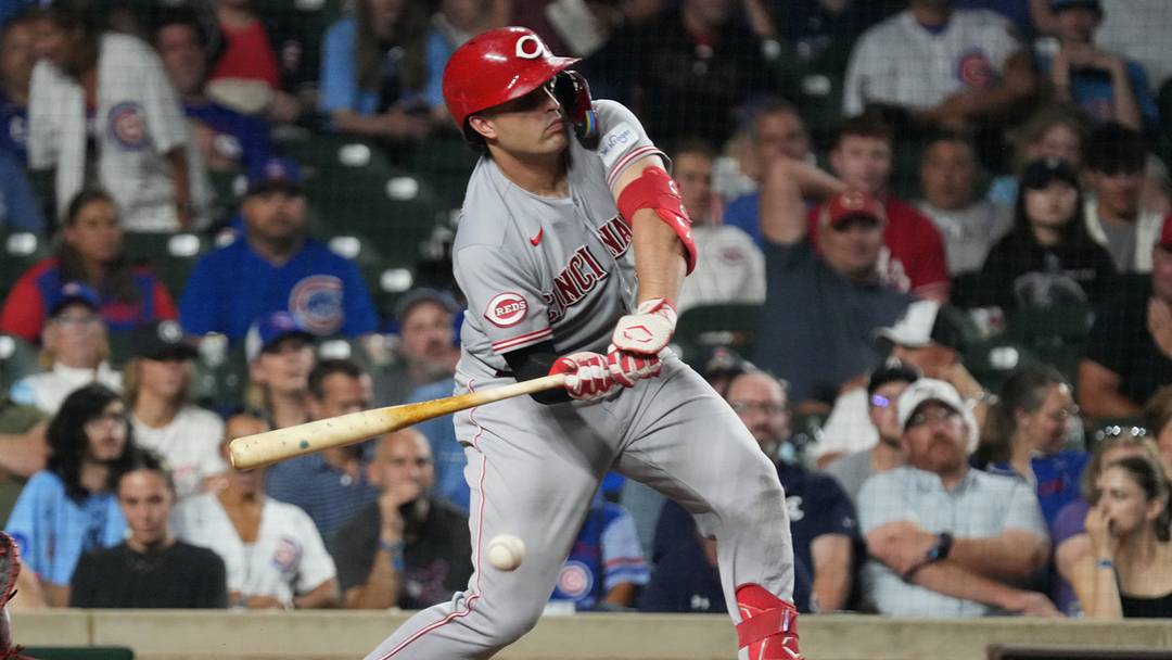 Aug 30, 2026; Chicago, Illinois, USA;  Cincinnati Reds first baseman Sal Stewart (27) hits a infield single against the Chicago Cubs during the ninth inning at Wrigley Field.  Mandatory Credit: David Banks-Imagn Images