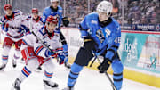 Erie Otters defenseman Matthew Schaefer, right, controls the puck against the Kitchener Rangers at Erie Insurance Arena in Erie on Nov. 23, 2024.
