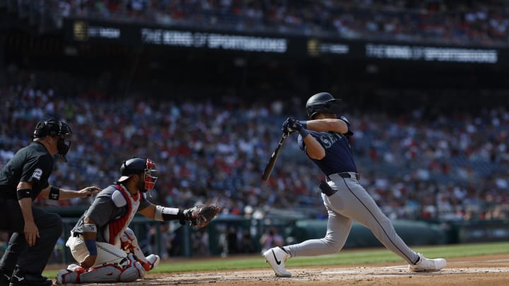 Seattle Mariners outfielder Dominic Canzone (8) singles against the Washington Nationals during the second inning at Nationals Park on May 25.