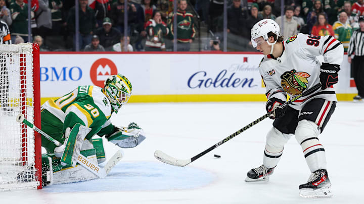 Jan 27, 2026; Saint Paul, Minnesota, USA; Chicago Blackhawks center Connor Bedard (98) misses a shot against Minnesota Wild goaltender Jesper Wallstedt (30) during a shootout at Grand Casino Arena. Mandatory Credit: Matt Krohn-Imagn Images