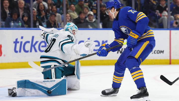 Mar 10, 2026; Buffalo, New York, USA;  San Jose Sharks goaltender Yaroslav Askarov (30) makes a pad save on Buffalo Sabres center Tage Thompson (72) during the second period at KeyBank Center. Mandatory Credit: Timothy T. Ludwig-Imagn Images