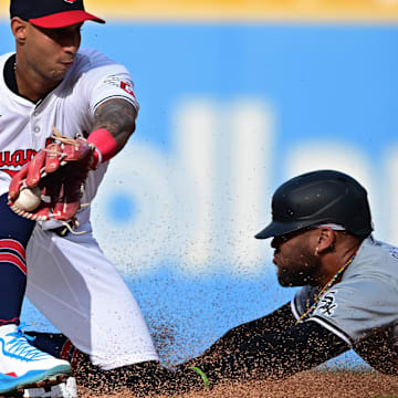 Apr 8, 2024; Cleveland, Ohio, USA; Chicago White Sox third base Yoan Moncada (10) steals second base during the first inning against the Cleveland Guardians at Progressive Field. Mandatory Credit: David Dermer-Imagn Images