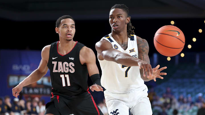 Nov 27, 2024; Paradise Island, Bahamas, BHS; West Virginia Mountaineers guard Javon Small (7) passes the ball as Gonzaga Bulldogs guard Nolan Hickman (11) defends during the first half at the Atlantis Resort.  Mandatory Credit: Kevin Jairaj-Imagn Images