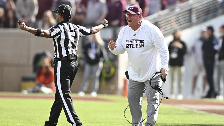 Dec 20, 2025; College Station, TX, USA; Texas A&M Aggies head coach Mike Elko reacts during the second half of the first round game of the CFP National Playoff against the Miami Hurricanes at Kyle Field. Mandatory Credit: Maria Lysaker-Imagn Images