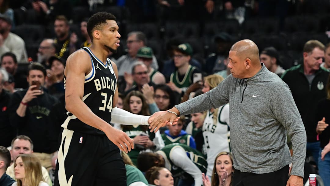 Apr 27, 2025; Milwaukee, Wisconsin, USA; Milwaukee Bucks forward Giannis Antetokounmpo (34) exits the game in the fourth quarter as head coach Doc Rivers shakes his hand during game four against the Indiana Pacers of first round for the 2024 NBA Playoffs at Fiserv Forum. Mandatory Credit: Benny Sieu-Imagn Images