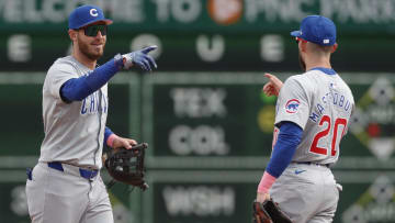 May 12, 2024; Pittsburgh, Pennsylvania, USA;  Chicago Cubs center fielder Cody Bellinger (left) and