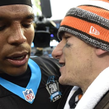 Dec 21, 2014; Charlotte, NC, USA; Carolina Panthers quarterback Cam Newton (1) with Cleveland Browns quarterback Johnny Manziel (2) after the game. The Panthers defeated the Browns 17-13 at Bank of America Stadium. Mandatory Credit: Bob Donnan-Imagn Images
