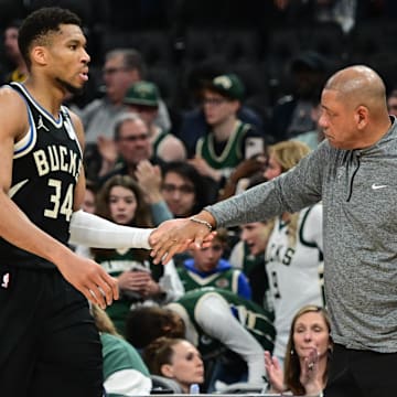 Apr 27, 2025; Milwaukee, Wisconsin, USA; Milwaukee Bucks forward Giannis Antetokounmpo (34) exits the game in the fourth quarter as head coach Doc Rivers shakes his hand during game four against the Indiana Pacers of first round for the 2024 NBA Playoffs at Fiserv Forum. Mandatory Credit: Benny Sieu-Imagn Images