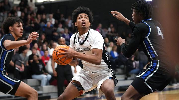 Millennium Tigers guard Adan Diggs (1) looks to shoot over O'Connor Eagles guard Melvin Stubbs (4) at Millennium in Goodyear, on Dec. 2, 2025.