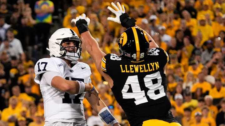 Iowa Hawkeyes defensive end Max Llewellyn (48) pressures Penn State Nittany Lions quarterback Ethan Grunkemeyer (17) during a college football game Oct. 18, 2025 at Kinnick Stadium in Iowa City, Iowa.