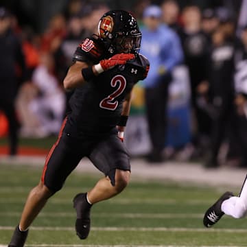 Nov 1, 2025; Salt Lake City, Utah, USA; Cincinnati Bearcats wide receiver Cyrus Allen (4) makes a catch against Utah Utes cornerback Smith Snowden (2) during the second quarter at Rice-Eccles Stadium. Mandatory Credit: Rob Gray-Imagn Images