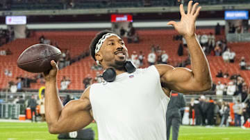 Dec 28, 2023; Cleveland, Ohio, USA; Cleveland Browns defensive end Myles Garrett (95) throws a football to fans before the game between the Browns and the New York Jets at Cleveland Browns Stadium. 