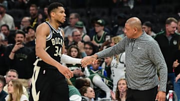 Apr 27, 2025; Milwaukee, Wisconsin, USA; Milwaukee Bucks forward Giannis Antetokounmpo (34) exits the game in the fourth quarter as head coach Doc Rivers shakes his hand during game four against the Indiana Pacers of first round for the 2024 NBA Playoffs at Fiserv Forum. Mandatory Credit: Benny Sieu-Imagn Images