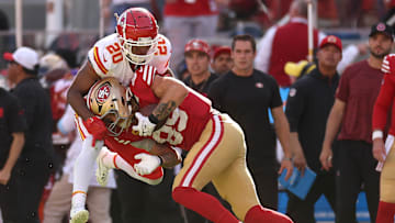 Kansas City Chiefs safety Justin Reid (20) and San Francisco 49ers tight end George Kittle (85)
