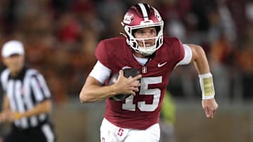 Sep 13, 2025; Stanford, California, USA; Stanford Cardinal quarterback Ben Gulbranson (15) carries the ball against the Boston College Eagles during the first quarter at Stanford Stadium. Mandatory Credit: Darren Yamashita-Imagn Images