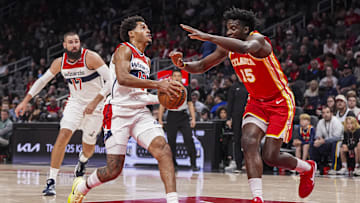 Oct 28, 2024; Atlanta, Georgia, USA; Washington Wizards guard Jordan Poole (13) is stripped of the ball by Atlanta Hawks center Clint Capela (15) during the first half at State Farm Arena. Mandatory Credit: Dale Zanine-Imagn Images