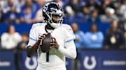 Oct 26, 2025; Indianapolis, Indiana, USA; Tennessee Titans quarterback Cam Ward (1) warms up before the game against the Indianapolis Colts at Lucas Oil Stadium. Mandatory Credit: Robert Goddin-Imagn Images