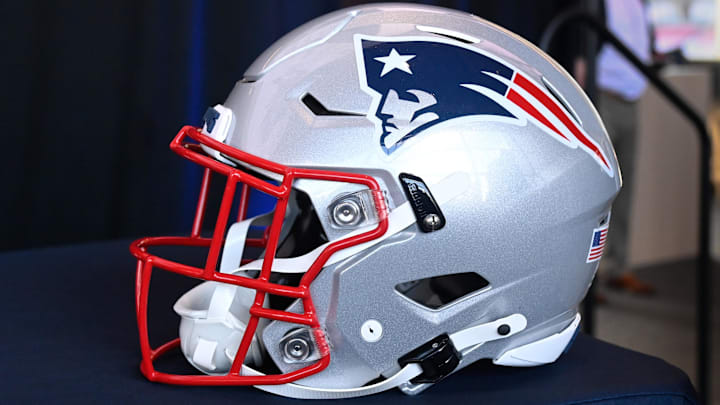 Jan 17, 2024; Foxborough, MA, USA; A New England Patriots helmet sits on a table prior to a press conference at Gillette Stadium. Mandatory Credit: Eric Canha-Imagn Images Jan 17, 2024; Foxborough, MA, USA; A New England Patriots helmet sits on a table prior to a press conference at Gillette Stadium. Mandatory Credit: Eric Canha-Imagn Images