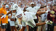 Mississippi State Bulldogs tight end Seydou Traore (8) dives for a touchdown against the Tennessee Volunteers during the second half at Davis Wade Stadium at Scott Field.