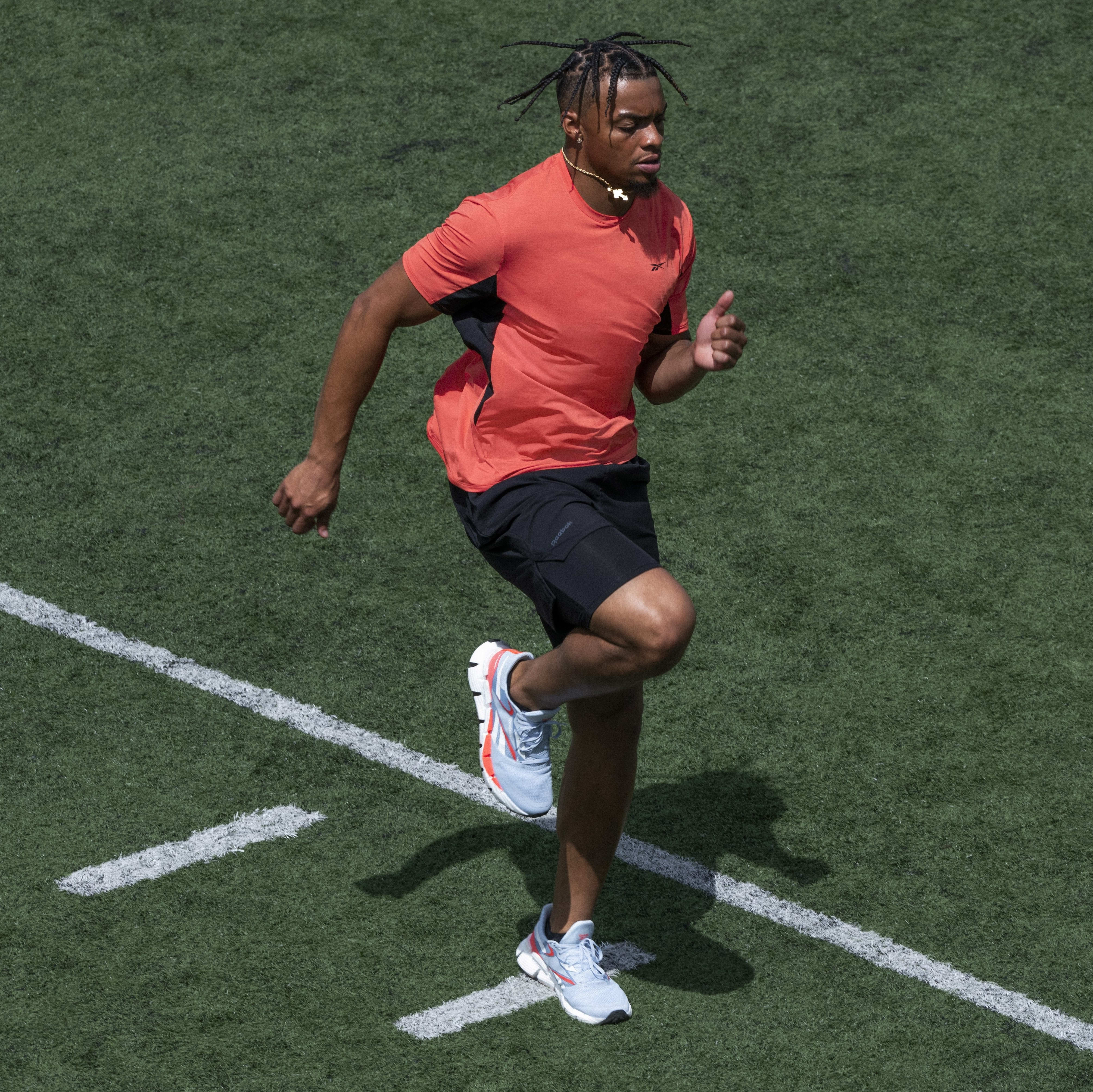 Justin Fields trains in Reebok apparel.