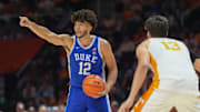 Duke forward Cameron Boozer (12) sends out instructions while guarded by Tennessee forward J.P. Estrella (13) during a college basketball exhibition game between on October 26, 2025, in Knoxville, Tenn.